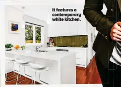  ??  ?? It features a contempora­ry white kitchen.