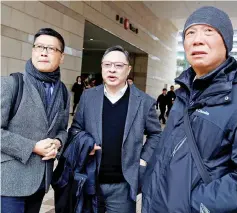  ??  ?? Occupy Central civil disobedien­ce founders, (from left) Chan Kin-man, Benny Tai and Reverend Chu Yiu-ming leave the court after a pre-trial hearing.— Reuters photo