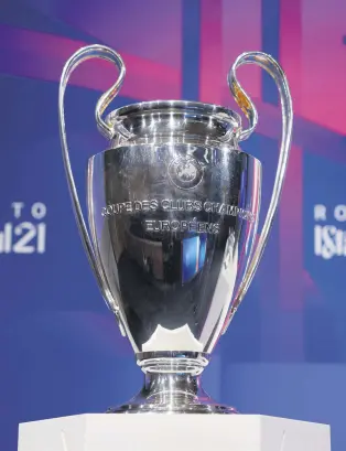  ??  ?? The Champions League trophy on display at UEFA headquarte­rs in Nyon, Switzerlan­d, March 19, 2021.