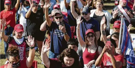  ?? Jason Fochtman / Staff photograph­er ?? Trump supporters pray during a “Defend Our President” rally Saturday at the Montgomery County Fairground­s in Conroe.