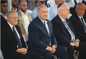  ?? (Flash90) ?? PRIME MINISTER Benjamin Netanyahu and President Reuven Rivlin attend a memorial ceremony for Ze’ev Jabotinsky at Mount Herzl in Jerusalem last year.