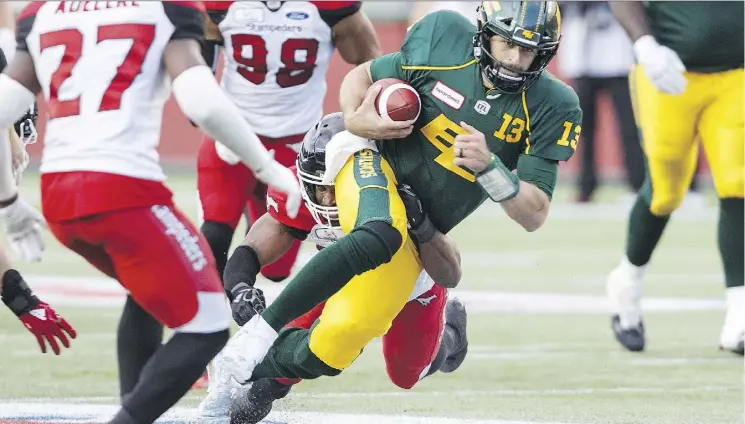  ?? JASON FRANSON/THE CANADIAN PRESS ?? Eskimos quarterbac­k Mike Reilly had a game for the ages Saturday with three touchdown passes and three more rushing at Commonweal­th Stadium.
