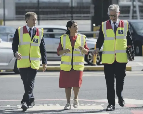  ??  ?? 0 Transport Secretary Grant Shapps, left, Home Secretary Priti Patel and no-deal Brexit ‘supremo’ Michael Gove in Dover yesterday