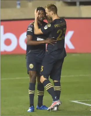  ?? PETE BANNAN – MEDIANEWS GROUP ?? The Union’s Kacper Przybylko, right, celebrates with teammate Cory Burke as time expired on a 1-1draw with Atlanta that advances the Union into the semifinals of the CONCACAF Champions League.