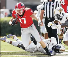  ?? BOB ANDRES / ROBERT.ANDRES@AJC.COM ?? UGA tight end Eli Wolf was targeted four times Saturday vs. the Murray State Racers and caught them all for a total of 73 yards receiving in the 63-17 win. He left Tennessee to play his final season at Georgia in hopes of drawing some NFL looks.