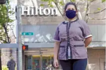  ?? AP PHOTO/TED S. WARREN ?? Sonia Guevara poses for a photo recently outside the Hilton hotel where she works as a housekeepe­r in downtown Seattle.