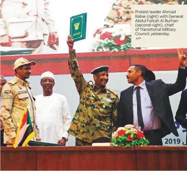 ?? AFP ?? Protest leader Ahmad Rabie (right) with General Abdul Fattah Al Burhan (second-right), chief of Transition­al Military Council, yesterday.