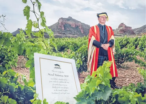  ??  ?? Norrel Robertson has been honoured as a Knight of the Grand Order of Spanish wine in recognitio­n of his success as a winemaker there.
