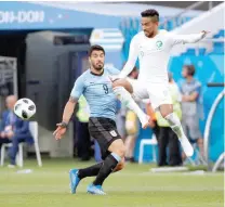  ?? — Reuters ?? Saudi Arabia’s Hattan Bahebri in action with Uruguay’s Luis Suarez.