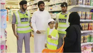  ??  ?? The public donates their excess food in boxes to the police, who distribute it to needy families.