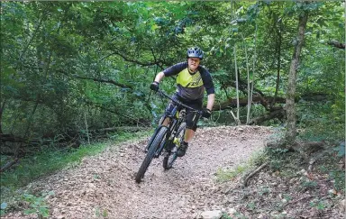  ?? Photo submitted ?? Charles Williams rides along the Pinyon Creek trail on Bella Vista's Back 40 Trails.