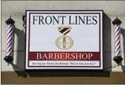  ??  ?? The sign outside Front Lines Barbershop. At Front Lines Barber Shop, a barbershop with a military and first responder theme in Shillingto­n, PA Monday morning March 29, 2021. The shop was opened by two veterans, and offers a 15% discount to military and first responders.
