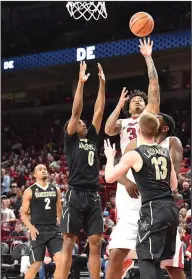  ?? Craven Whitlow/Special to the News-Times ?? Tough shot: Arkansas' Anton Beard takes a shot during the Razorbacks' SEC contest against Vanderbilt in Fayettevil­le. Arkansas will host Texas A&M on Saturday.