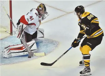  ?? STAFF PHOTO BY CHRISTOPHE­R EVANS ?? NO GOAL: Senators goalie Craig Anderson makes a save on David Pastrnak during the second period of last night’s game at the Garden.