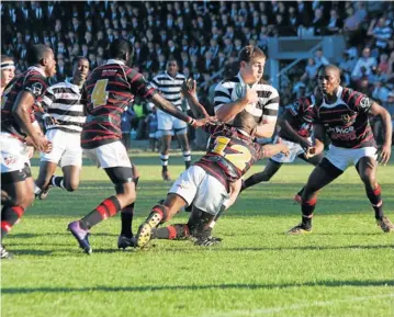 ?? Picture: PAUL WETMORE ?? MAN DOWN: Jedwyn Harty of Selborne College is tackled by the captain of Dale College, Sibanye Bukani with Dale lock Luwanda Mbi (4) running in to support