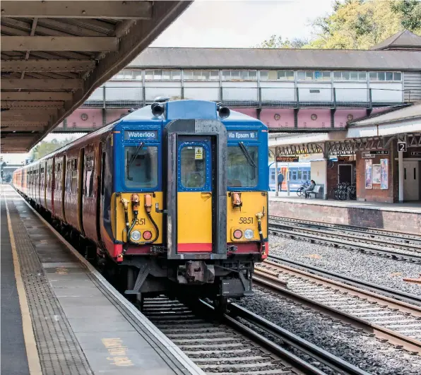  ?? JACK BOSKETT/ RAIL. ?? The latest national travelling statistics point to commuting by car falling by 18% in the last 20 years, while the number of rail passengers has more than doubled. A commuter service awaits departure from Weybridge on April 28.