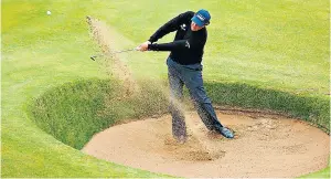  ??  ?? Battle royale: Henrik Stenson, the Open leader (main picture, left), watches rival Phil Mickelson tee off; the American plays out of a bunker on the 18th hole (left)