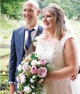  ??  ?? Soulmates: Debbie and Lawrence on their wedding day