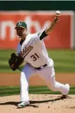  ?? Thearon Henderson / Getty Images 2014 ?? Jon Lester’s stay with the A’s had a forgettabl­e ending in the 2014 wild-card game.