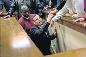  ?? Photo: Marco Longari/Reuters ?? Off the tracks: Oscar Pistorius is taken to prison after being sentenced to six years for murder this week.