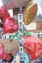 ?? STU BOYD II/THE COMMERCIAL APPEAL ?? A memorial is set up at the corner of Castlegate Lane and Bear Creek Cove for Tyre Nichols. It’s the location where Nichols was beaten by Memphis police officers.