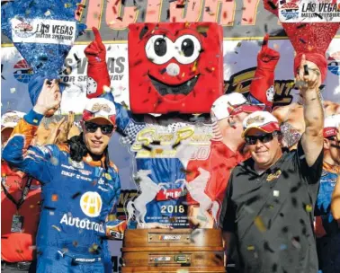  ?? AP PHOTO/ISAAC BREKKEN ?? Brendon Gaughan, right, presents Brad Keselowski with a trophy for winning the Cup Series race Sunday in Las Vegas.