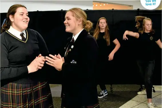  ??  ?? READY TO SING: Fairholme College students prepare to perform at the Women of Strength luncheon (from left) Grace Gallagher and Georgia Brass sing while Emma Scanlon and MJ Scanlon prepare their dance moves. PHOTO: BEV LACEY