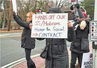  ?? SEAN ZANNI/GETTY IMAGES FOR MOVEON ?? Demonstrat­ors oppose cuts to Social Security and Medicare at a protest event held in Huntington, N.Y., last month.