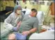  ?? AP ?? Brian Madeux sits with his girlfriend Marcie Humphrey at a hospital California.