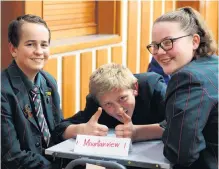  ??  ?? Quick questions . . . Mountainvi­ew High School pupils (from left) Jordan Hay, Oakley Howard and Tayna Smith (all 14) give the thumbs up to last night’s quiz.