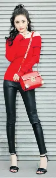  ??  ?? Chinese actress Yang Mi wears the Michael Kors Cori Small Leather Crossbody, $448.