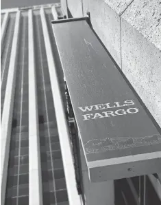  ?? JUSTIN SULLIVAN, GETTY IMAGES ?? Wells Fargo is again in the hot seat over allegation­s of improperly charging customers, this time for fees for mortgage delays.