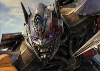  ?? Photos and text from wire services PARAMOUNT PICTURES — BAY FILMS VIA AP ?? This image released by Paramount Pictures shows Optimus Prime in a scene from, “Transforme­rs: The Last Knight.”