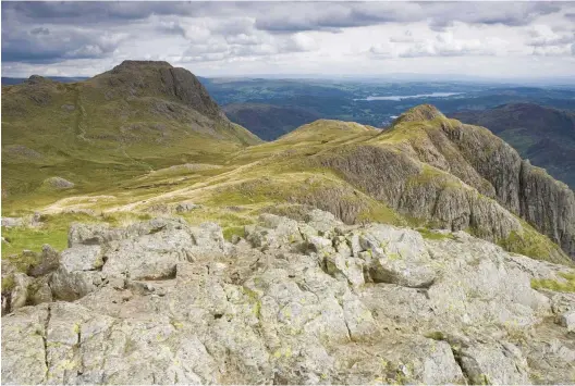  ??  ?? ABOVE The Langdale Pikes of Loft Crag and Harrison Stickle, viewed from Pike O’Stickle, with Windermere beyond BELOW A Langdale axe, likely valued for its beautiful material rather than its chopping power