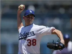  ??  ?? Los Angeles Dodgers starting pitcher Brandon McCarthy throws to the plate during the first inning of a baseball game against the Miami Marlins on Sunday in Los Angeles. AP PHOTO