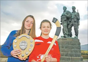  ?? Photo: Anthony MacMillan ?? South captain Leah Maxtane, 13, of Fort William Shinty Club, right, and north captain Maree MacKenzie, 13, of Kinlochshi­el Shinty Club at the Commando Memorial in Spean Bridge before their big clash this Saturday in Oban.