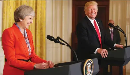  ?? (Carlos Barria/Reuters) ?? US PRESIDENT Donald Trump and British Prime Minister Theresa May smile at a joint news conference at the White House last week.