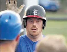  ?? COREY LEBLANC/SPECIAL TO POSTMEDIA NEWS ?? Niagara Falls Expos pitcher Ryan Langdon high-fives teammates after hitting a home run for the game-winning run in senior men's baseball against the Fort Erie Cannons Wednesday night at Oakes Park in Fort Erie.