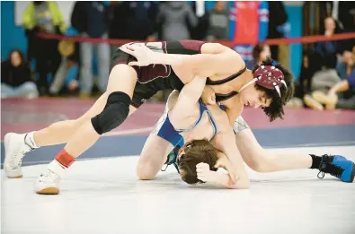  ?? FILE ?? Broadneck’s Cam Williams, left, works to turn Leonardtow­n’s Nolan Wood in the 113-pound championsh­ip match during the Class 4A/3A East Region Tournament.