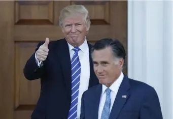  ?? ?? TURNED ON HIM: President-elect Donald Trump gives the thumbs-up as Mitt Romney leaves Trump National Golf Club Bedminster in Bedminster, N.J., Nov. 19, 2016.