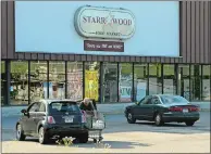  ?? DANA JENSEN/THE DAY ?? A customer loads shopping bags into his vehicle after shopping at Starrwood Food Market located in the Taftville section of Norwich on Thursday. The market will soon be closing at this location.