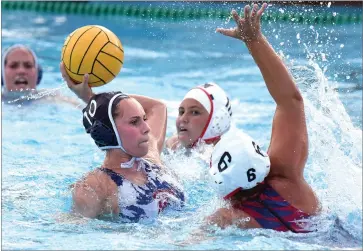  ?? RECORDER PHOTO BY CHIEKO HARA ?? Strathmore High School’s Paulina Cemo, left, scores a goal over Tulare Western High School’s defenders Wednesday during the second half at Strathmore High School.