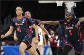  ?? PAUL SANCYA — THE ASSOCIATED PRESS ?? St. John’s guard Jayla Everett, left, reacts after hitting the game-winning shot against Purdue in the First Four round of the NCAA Tournament on Thursday in Columbus, Ohio.