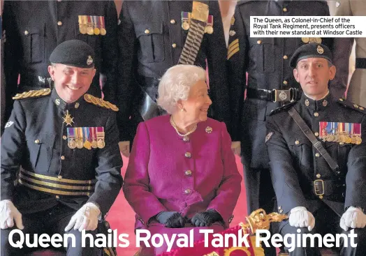  ??  ?? The Queen, as Colonel-in-Chief of the Royal Tank Regiment, presents officers