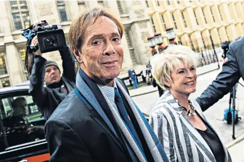  ??  ?? Sir Cliff Richard arrives at the High Court in London with Gloria Hunniford