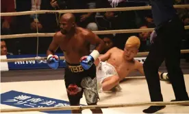  ??  ?? Floyd Mayweather knocks down kickboxer Tenshin Nasukawa during their exhibition boxing match at Saitama Super Arena. Photograph: Toshifumi Kitamura/AFP/Getty Images