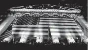  ?? [AP FILE PHOTO] ?? An American flag hangs on the front of the New York Stock Exchange in New York.