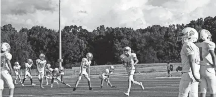  ?? COMMERCIAL APPEAL ?? September 06 2018 - Lakeland players warm up before the start of the first home game to take place at Lakeland Middle School. Until the start of this game, all of Lakeland Middle School's football games were played away. BRAD VEST/THE