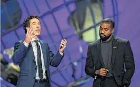  ?? Godofredo A. Vásquez / Staff photograph­er ?? Senior pastor Joel Osteen, left, and West discuss faith at Lakewood Church, the largest church in which West has made an appearance.
