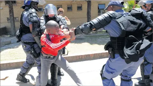  ?? PICTURE: CINDY WAXA ?? STAND-OFF: A student tries to break free from police at the Cape Peninsula University of Technology yesterday, where a violent protest led to the arrest of 27 students.